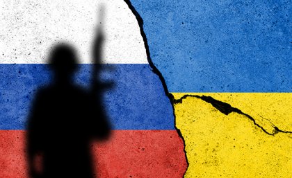 The flags of Russia and Ukraine with the silhouette of a soldier in front 